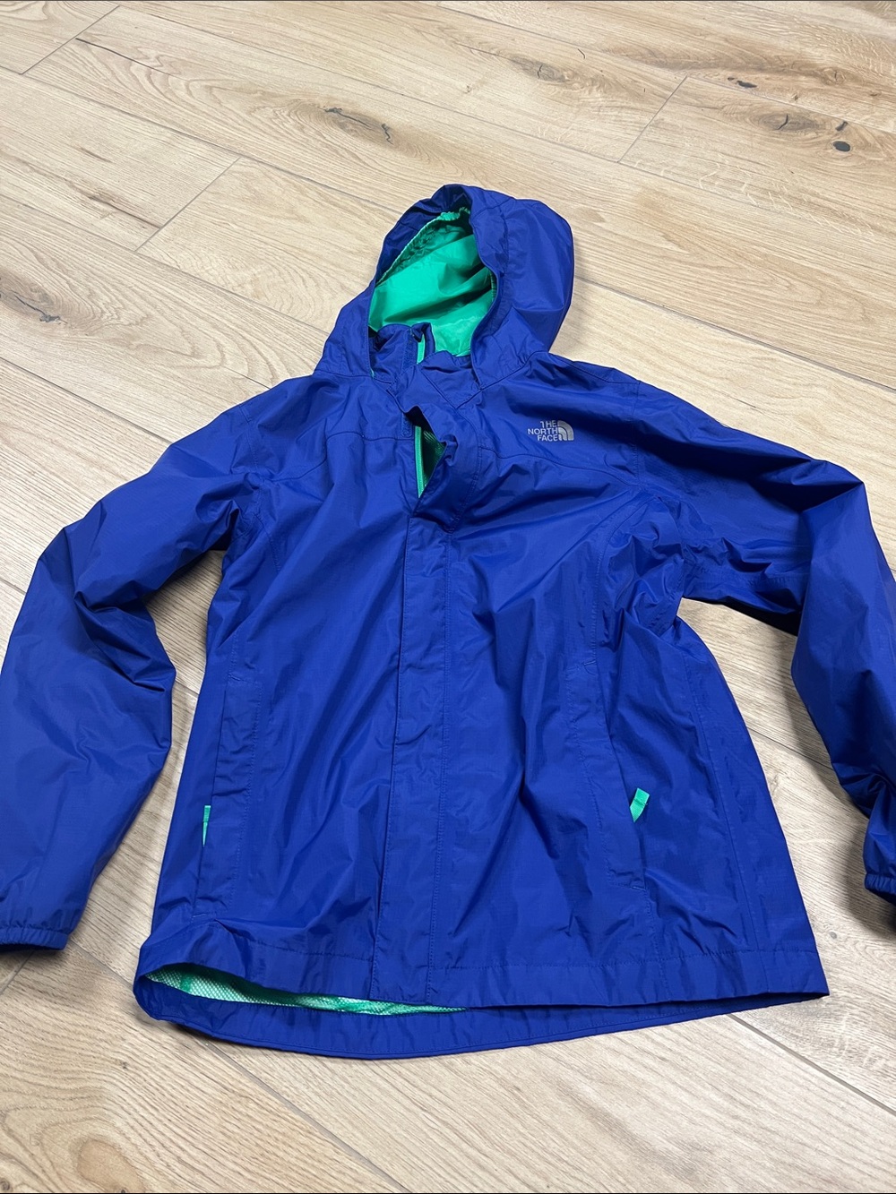The North Face Blue Hooded Kids Rain Jacket with Green Lining